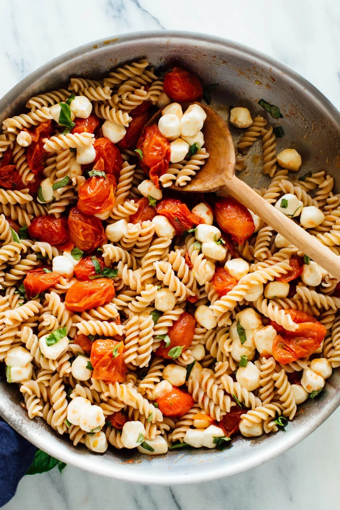 Delicious Caprese Pasta Salad with fresh tomatoes, mozzarella, and basil
