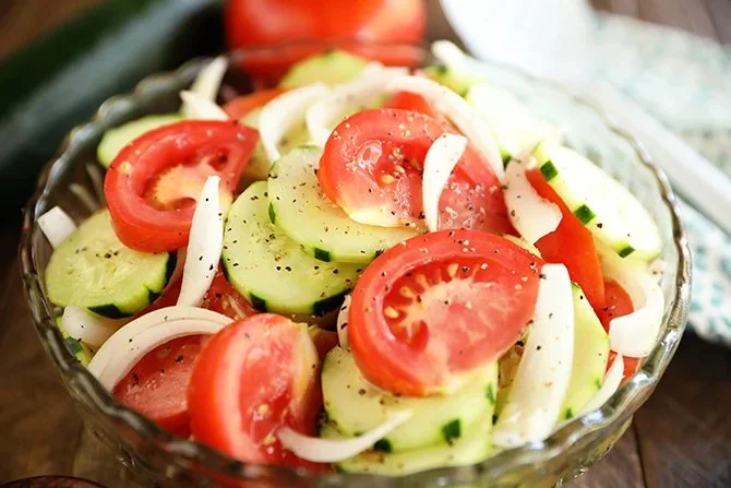 Fresh Tomato, Cucumber, and Onion Salad served in a bowl for a healthy meal.