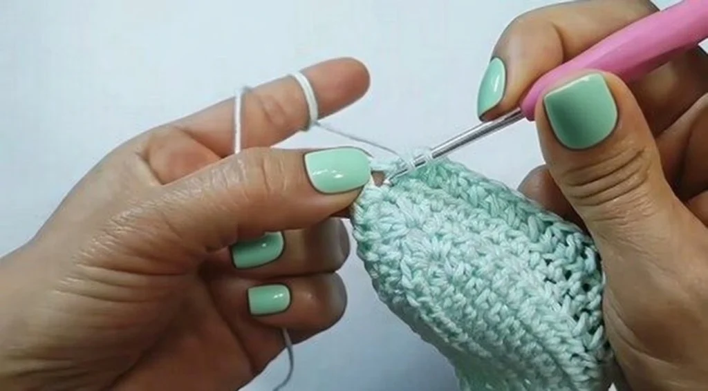 Step by step tutorial showing how to crochet halter top cups with fan stitch pattern