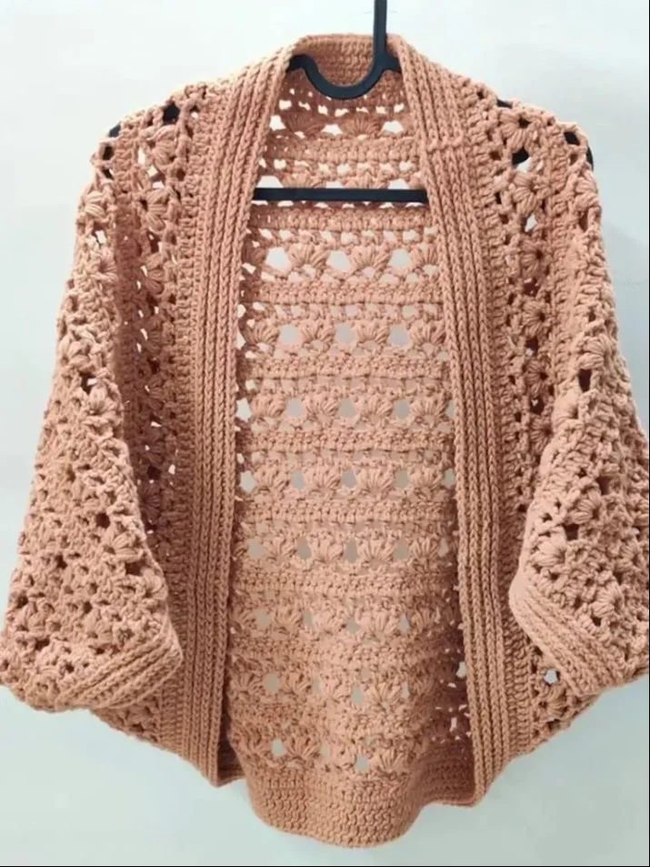 Cozy crochet cocoon shrug pattern for beginners displayed on a mannequin